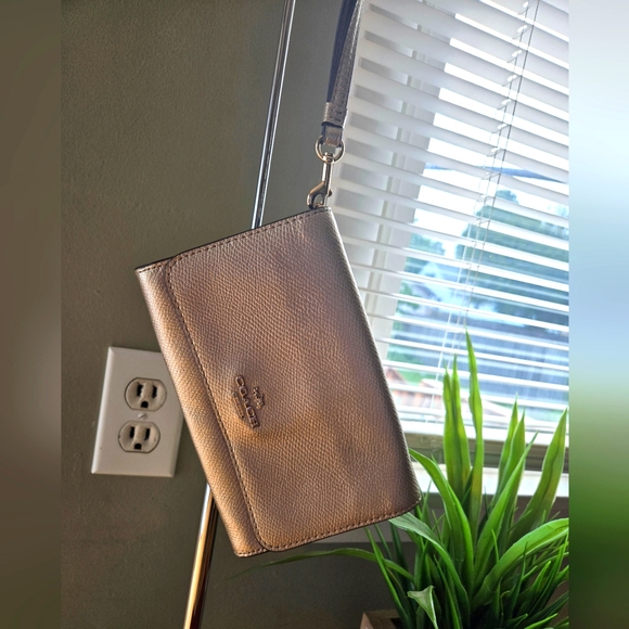 Coach Handbags - Coach wristlet Metallic Gold